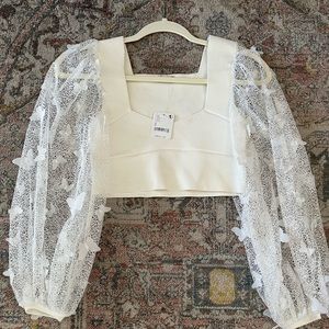 Free people white lace top with floral appliqués